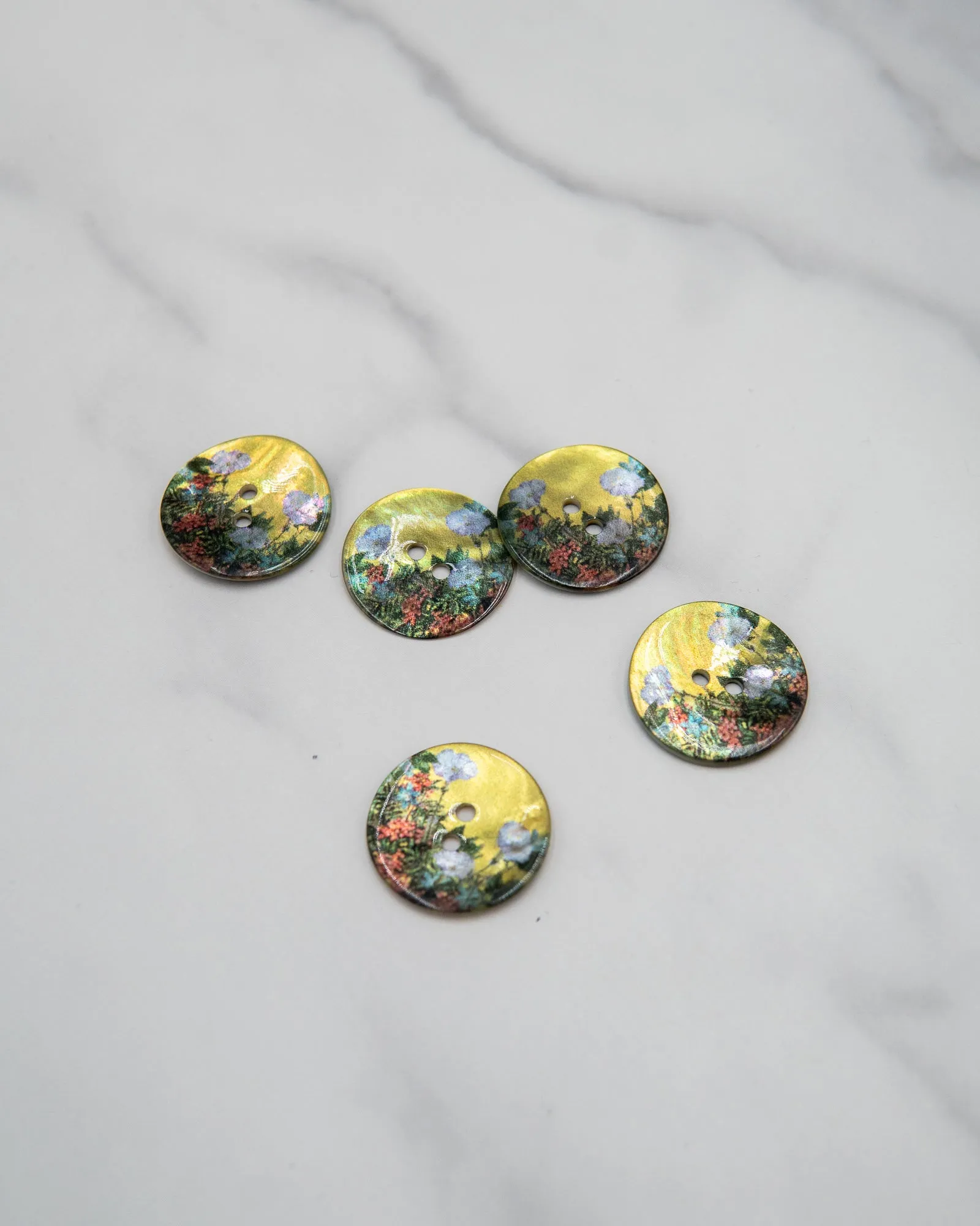 Glossy shell buttons with flowers on yellow background - 23 mm or 9/10"