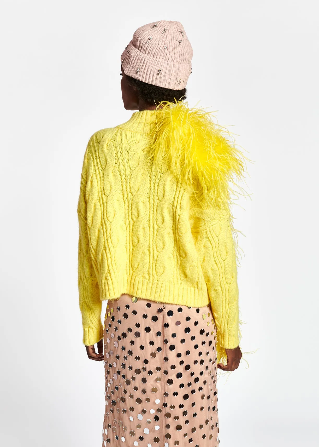 Pastel yellow cable-knit sweater
