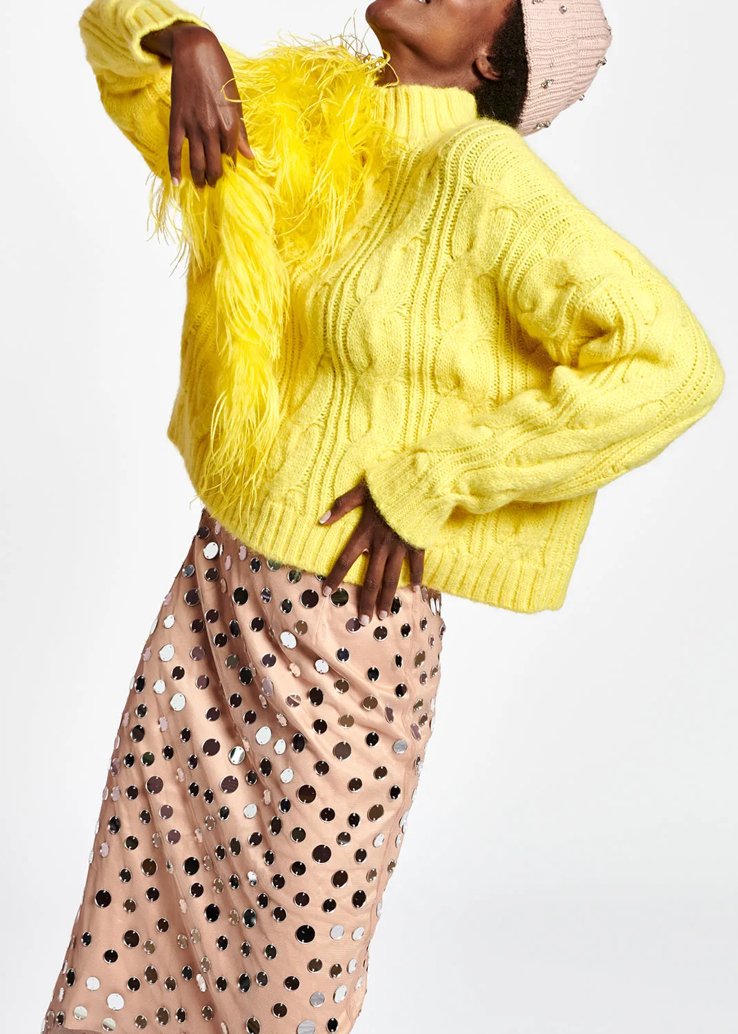 Pastel yellow cable-knit sweater